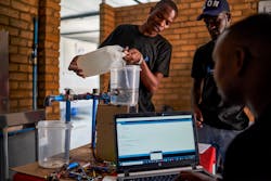 Team mamenbers at Aqua Solutions pour water to be purified by a prototype of the system at a laboratory on Oct. 30, 2022 in Hatfield, Harare. Currently, Harare's greater metropolitan area has about 4.5 million people, more than half of whom have no access to clean water and are at risk of water-borne diseases such as cholera and typhoid. Team mamenbers at Aqua Solutions pour water to be purified by a prototype of the system at a laboratory on Oct. 30, 2022 in Hatfield, Harare. Currently, Harare's greater metropolitan area has about 4.5 million people, more than half of whom have no access to clean water and are at risk of water-borne diseases such as cholera and typhoid.