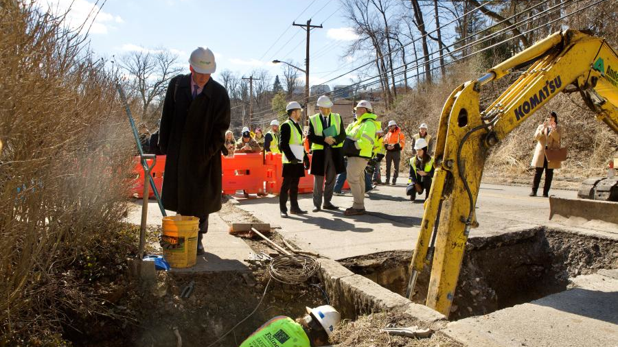 Bruno Piggot, deputy assistant administrator for the EPA&rsquo;s Office of Water, watches as crews replace lead service line on Hazelwood Avenue.