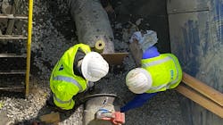 San Jose Water employees cap a water main. San Jose Water employees cap a water main.