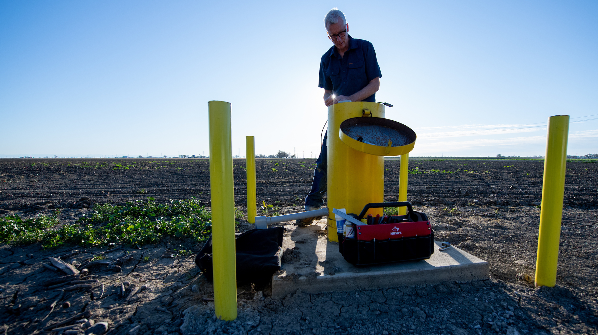 Aaron Cuthbertson, engineering geologist with the California Department of Water Resources, measures groundwater levels in Yolo County.