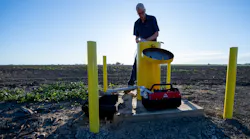 Aaron Cuthbertson, engineering geologist with the California Department of Water Resources, measures groundwater levels in Yolo County.