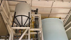 Water treatment takes places inside the large contactor tank; the smaller tank on the left stores the resin that is dosed into the system. Water treatment takes places inside the large contactor tank; the smaller tank on the left stores the resin that is dosed into the system.