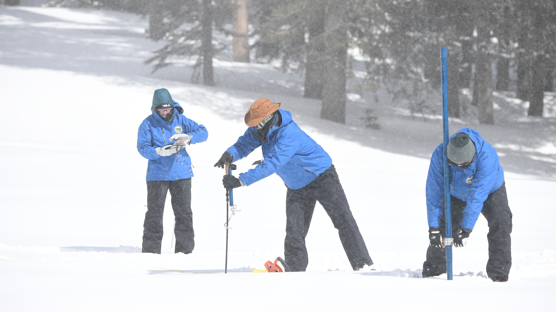 DWR staff conduct the fourth snow survey of the season at Phillips Station on April 3, 2023.