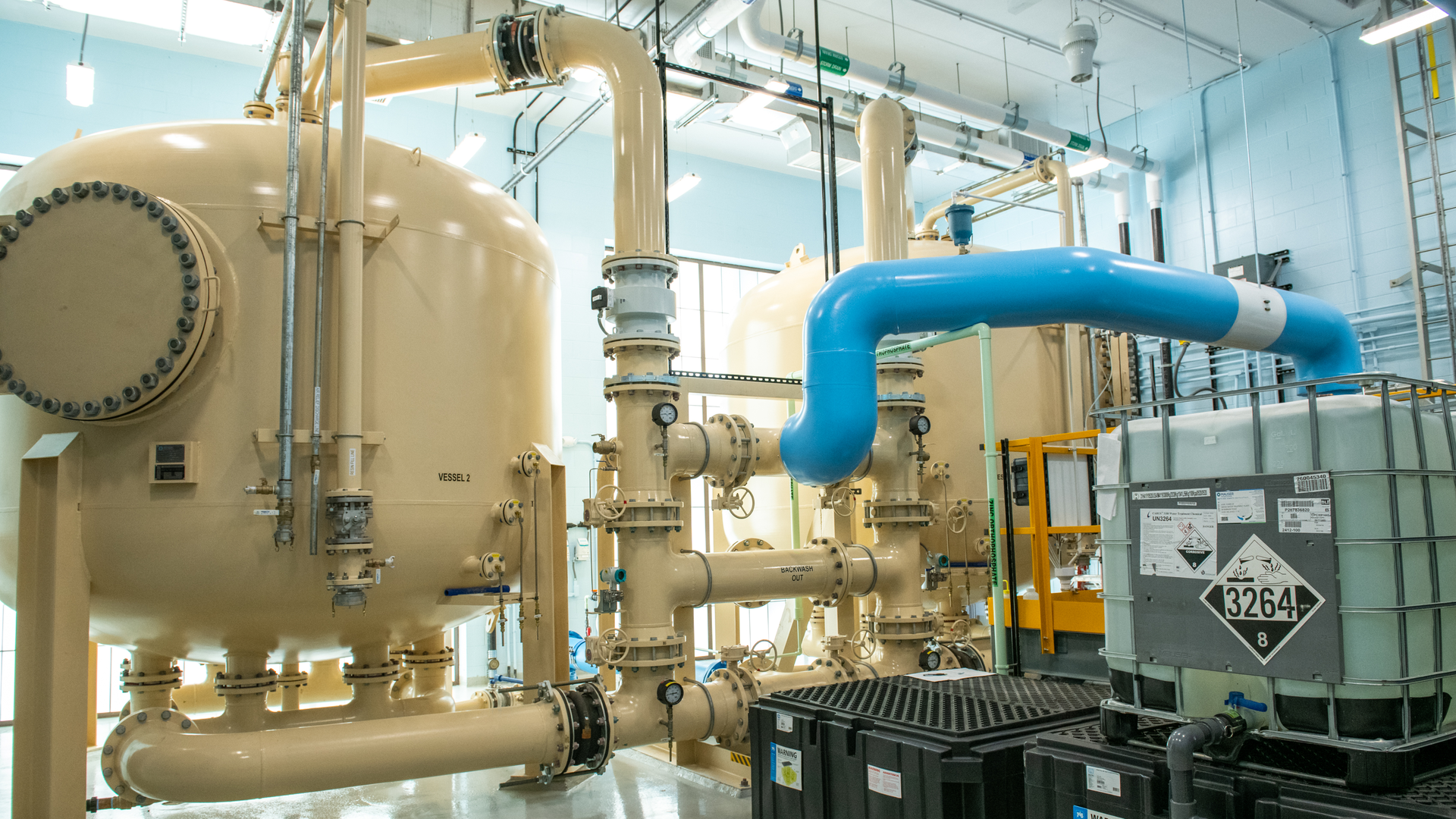 An anion exchange system can provide a smaller footprint and lower height, while requiring fewer lead-lag pairs of vessels for a similar lifecycle cost to GAC.