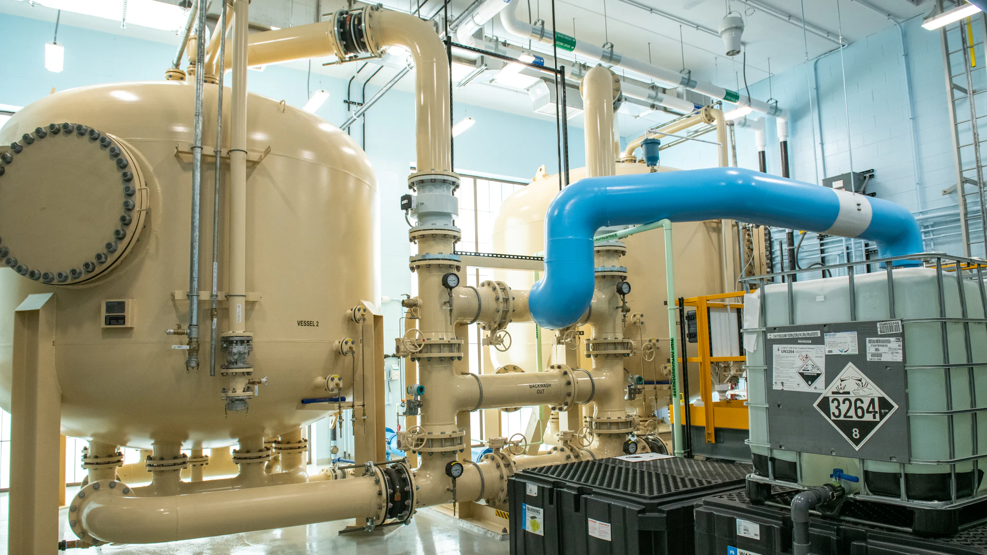 An anion exchange system can provide a smaller footprint and lower height, while requiring fewer lead-lag pairs of vessels for a similar lifecycle cost to GAC.