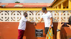 Country Director of Play Soccer Ghana, Franklin Asuo and Joleon Lescott.