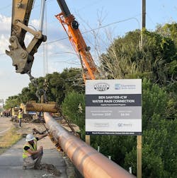 Figure 3. At the construction site, several 40-foot pipe sections were welded together before being added to the full-length water main, which was pre-staged along a public road ahead of installation.