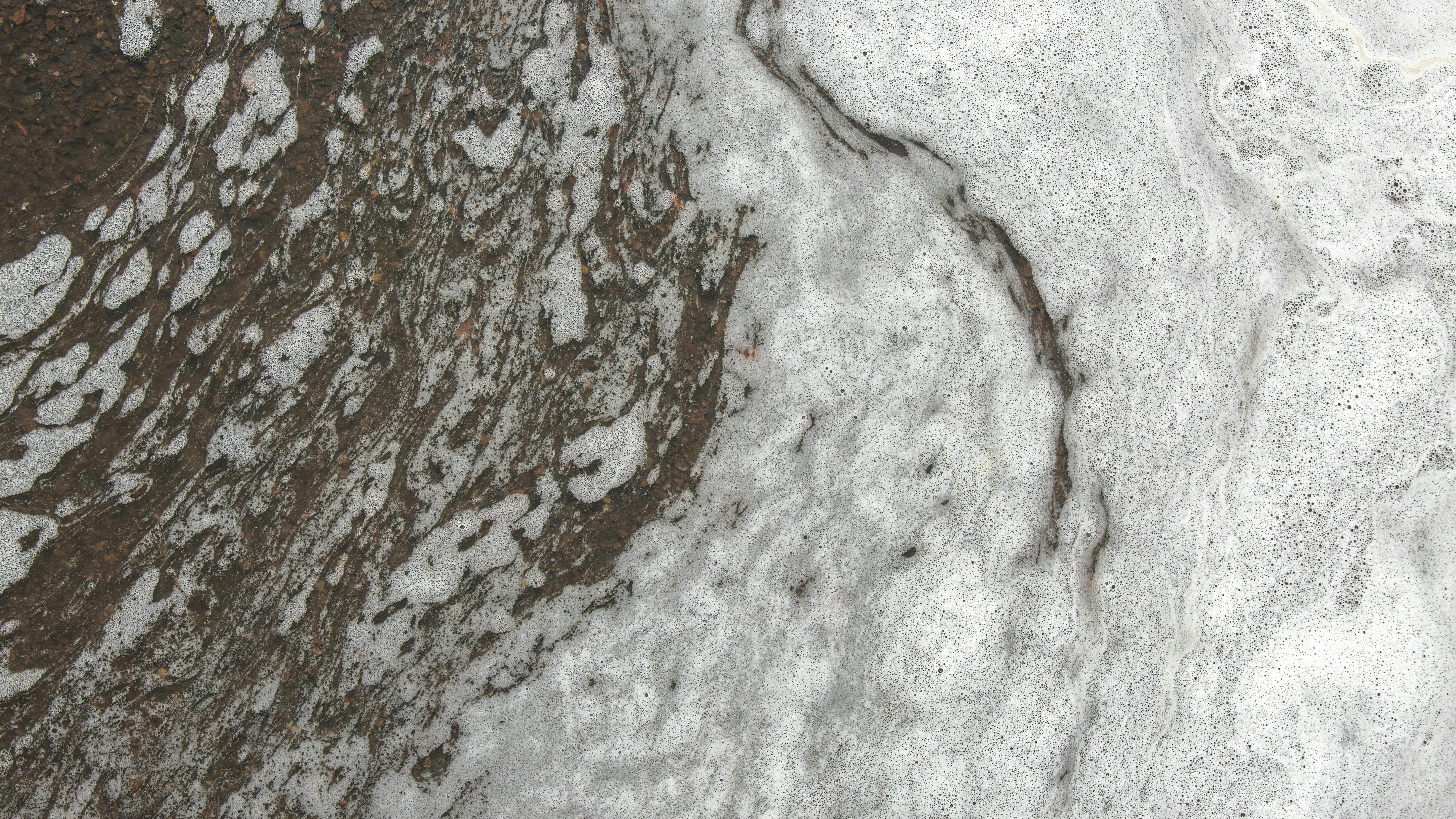 PFOS chemical fire fighting foam floating down the street.