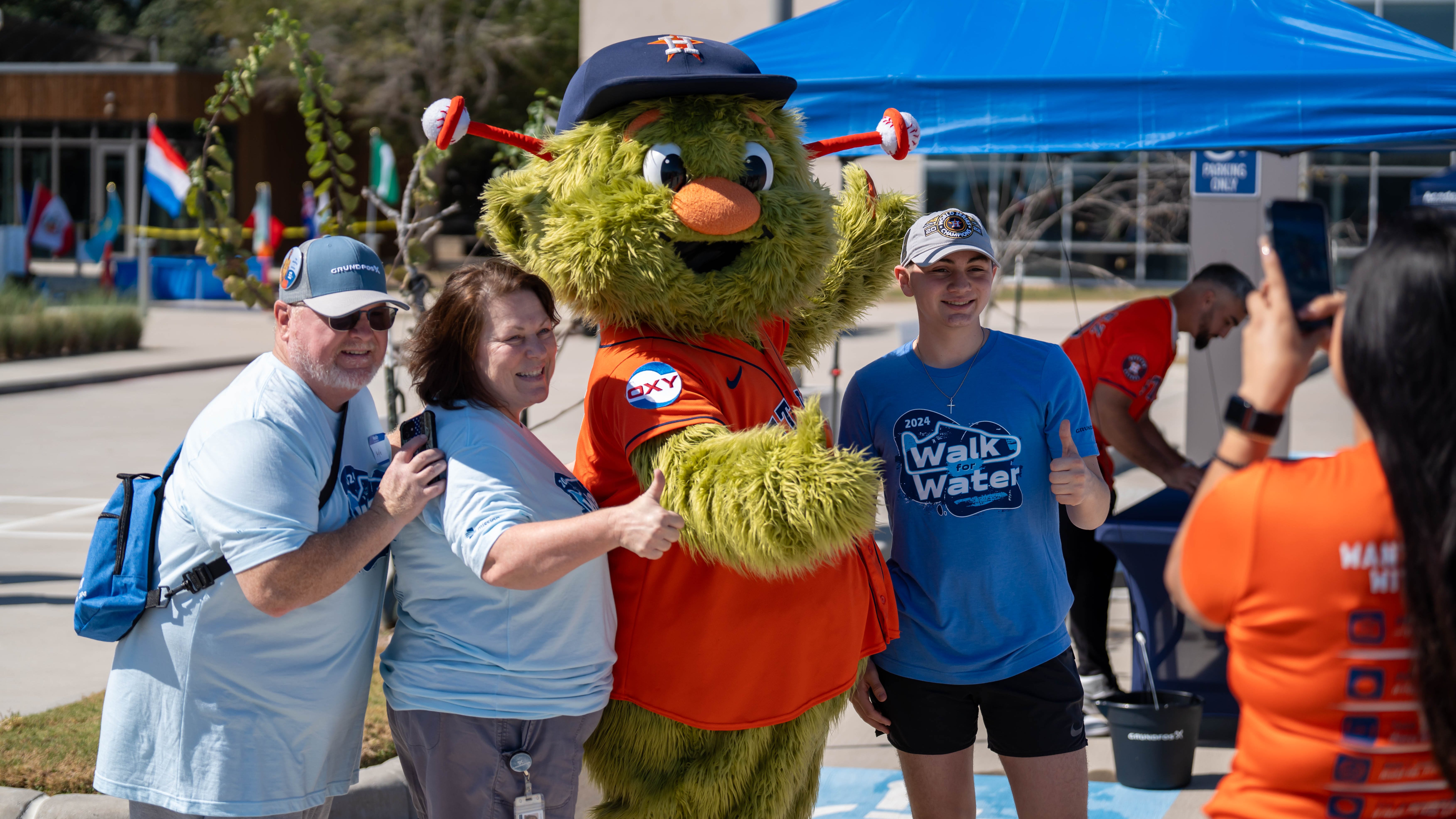 Walk for Water walkers posing with Orbit.