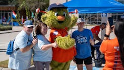 Walk for Water walkers posing with Orbit. Walk for Water walkers posing with Orbit.