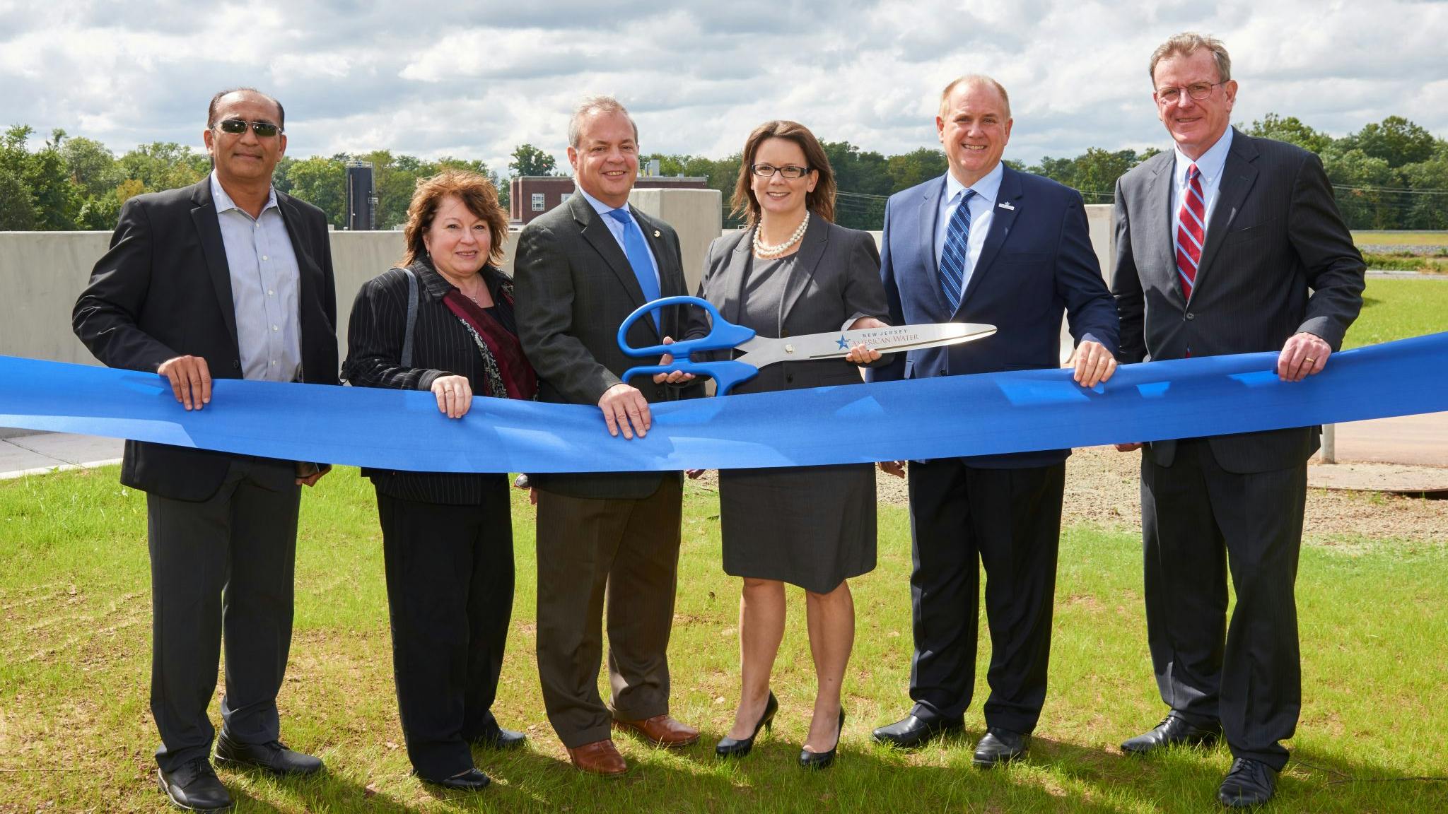 New Jersey American Water celebrated the completion of its $37 million flood protection project at its Raritan-Millstone Water Treatment Plant with a ribbon-cutting ceremony on the grounds of the plant. Pictured, from left to right &ndash; Manoj Patel, PE PMP, Senior Project Engineer, New Jersey American Water; Maria Moran, Director of Division of Water, New Jersey Board of Public Utilities; Dave Zimmer, Executive Director, New Jersey Infrastructure Bank; Deborah Degillio, President, New Jersey American Water and Sr. V.P. Eastern Division, American Water; Robert Schaefer, Sr. Director of Central Operations, New Jersey American Water; and Michael Kerwin, President and CEO of the Somerset County Business Partnership. (Photo: Business Wire)