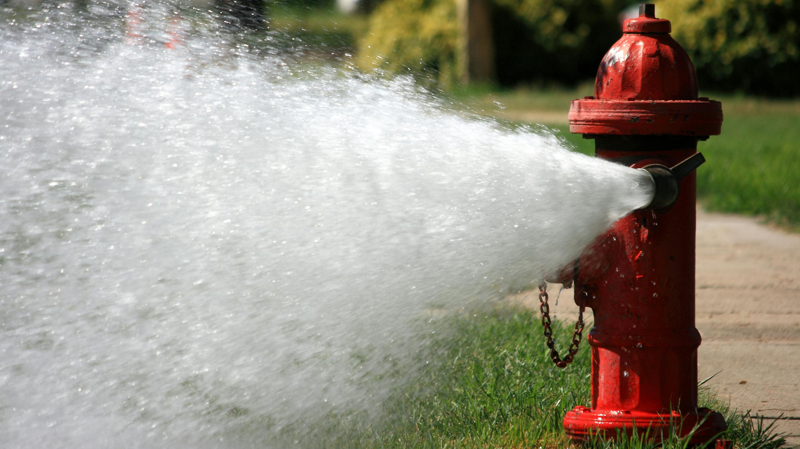 Open Fire Hydrant Gushing High Pressure Water