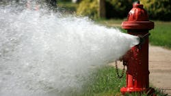 Open Fire Hydrant Gushing High Pressure Water Open Fire Hydrant Gushing High Pressure Water