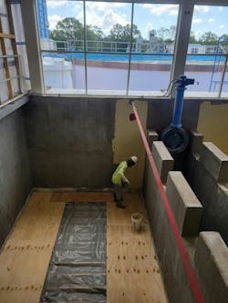 Figure 5: Applicators hand-applied Dura-Plate 2300 at an average thickness of 3/16 inch, forming a durable base for the new coatings. Figure 5: Applicators hand-applied Dura-Plate 2300 at an average thickness of 3/16 inch, forming a durable base for the new coatings.