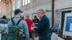 Alex Margevicius (right), P.E., commissioner, Division of Water, explains the history and processes of the plant Alex Margevicius (right), P.E., commissioner, Division of Water, explains the history and processes of the plant