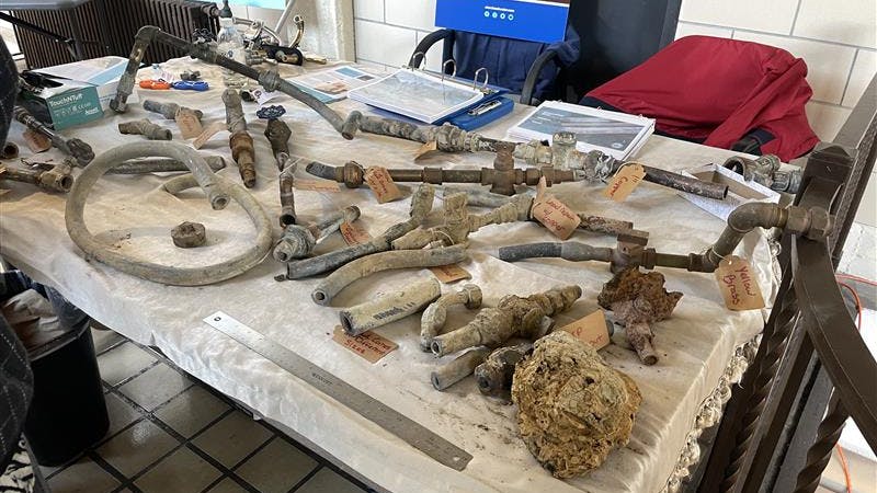 A display of a variety of pipe materials including lead lines.