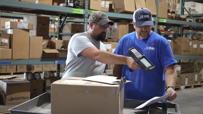 An LB Water employee uses a handheld RF computer for faster order fulfillment. After deploying their new WMS, LB Water’s Stoneboro warehouse saw significant efficiency gains.