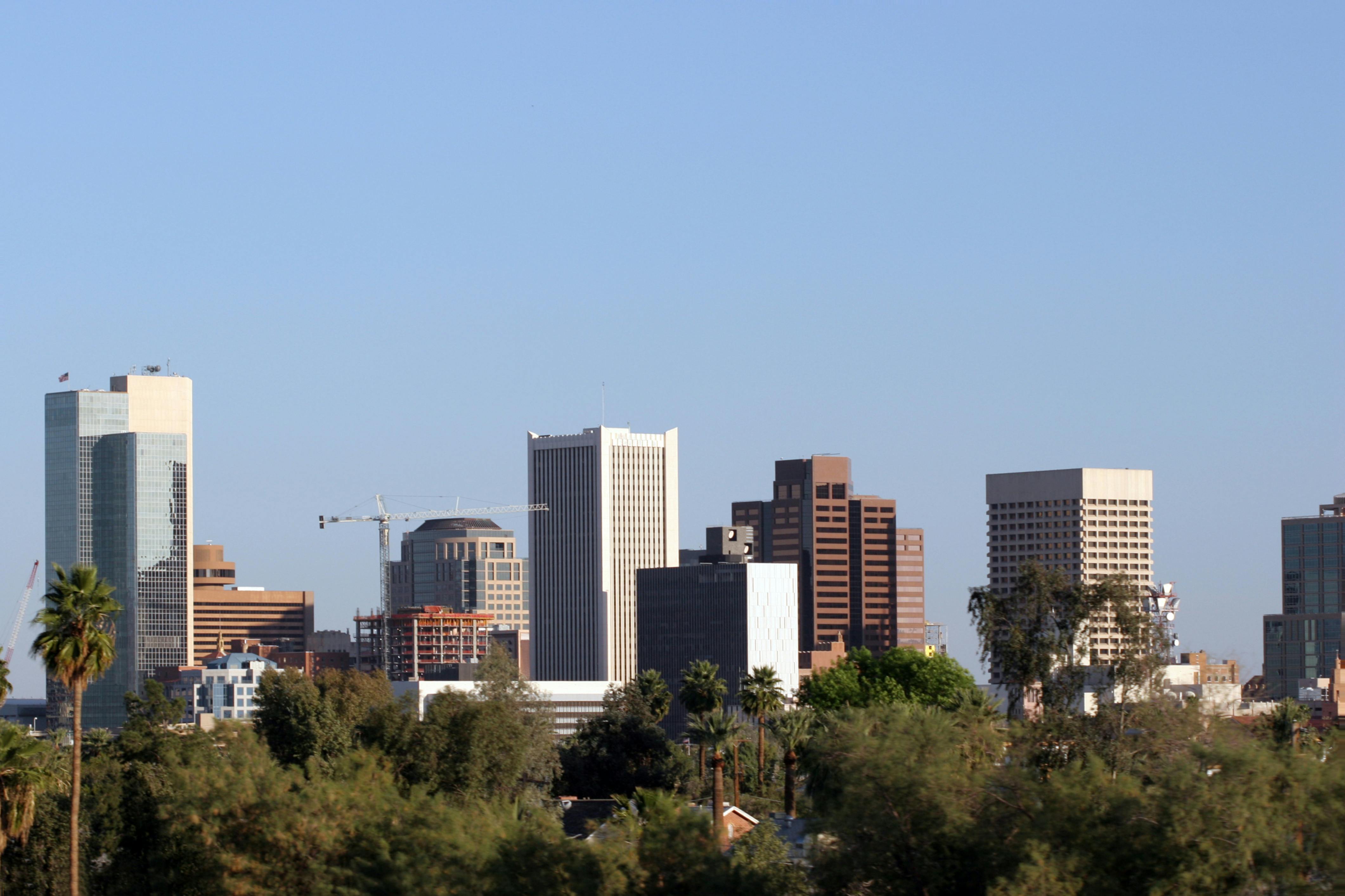Phoenix Skyline, AZ. Skyscrapers and Single Family Houses Roofs in Downtown of Phoenix, AZ