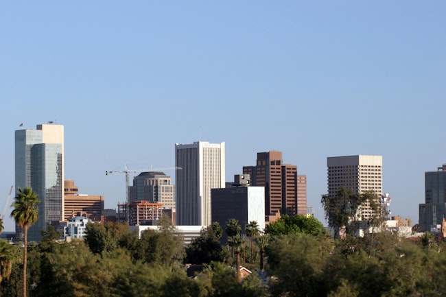 Phoenix Skyline, AZ. Skyscrapers and Single Family Houses Roofs in Downtown of Phoenix, AZ