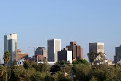 Phoenix Skyline, AZ. Skyscrapers and Single Family Houses Roofs in Downtown of Phoenix, AZ Phoenix Skyline, AZ. Skyscrapers and Single Family Houses Roofs in Downtown of Phoenix, AZ