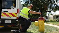 Travis Crawford listening for leaks. Travis Crawford listening for leaks.
