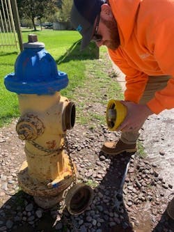 Aaron Metcalf, Missoula Water, checking a SmartCap (Photo credit: Missoula Water). Aaron Metcalf, Missoula Water, checking a SmartCap (Photo credit: Missoula Water).