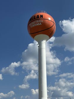 Figure 1: Towering above Milan, Indiana, the new tank makes a bold visual statement in Knockout Orange – a custom-selected shade fine-tuned to echo the look of a basketball. Photo courtesy of Fleis & VandenBrink Figure 1: Towering above Milan, Indiana, the new tank makes a bold visual statement in Knockout Orange – a custom-selected shade fine-tuned to echo the look of a basketball. Photo courtesy of Fleis & VandenBrink