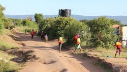 A group of young Masai carrying water A group of young Masai carrying water