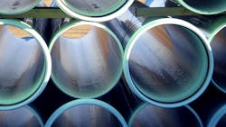 Water or sewer pipes stacked in storage area Water or sewer pipes stacked in storage area