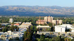 Diablo mountains and an aerial view of buildings around San Jose California Diablo mountains and an aerial view of buildings around San Jose California