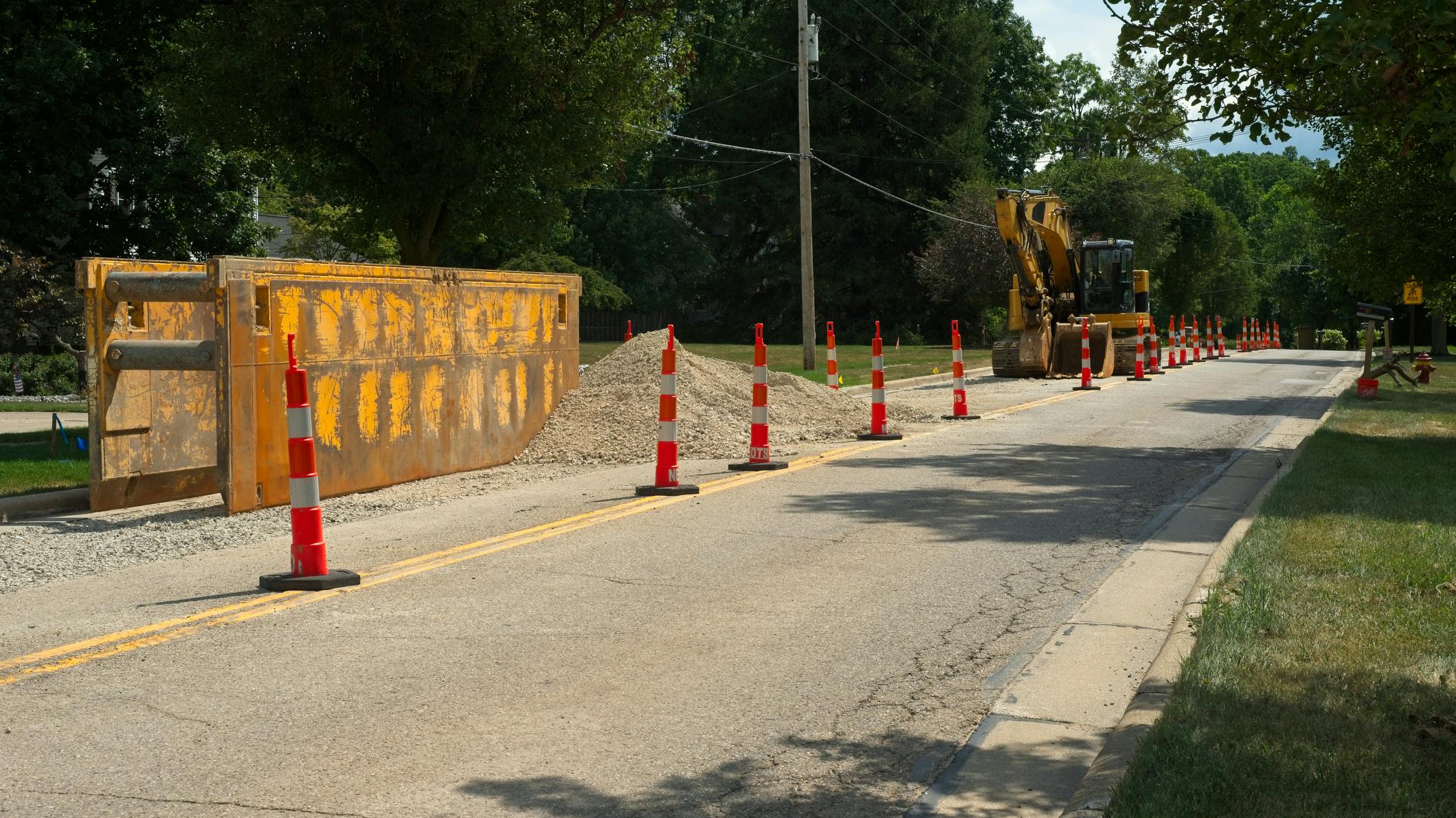 A trench box and excavator for water line replacement