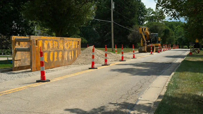 A trench box and excavator for water line replacement
