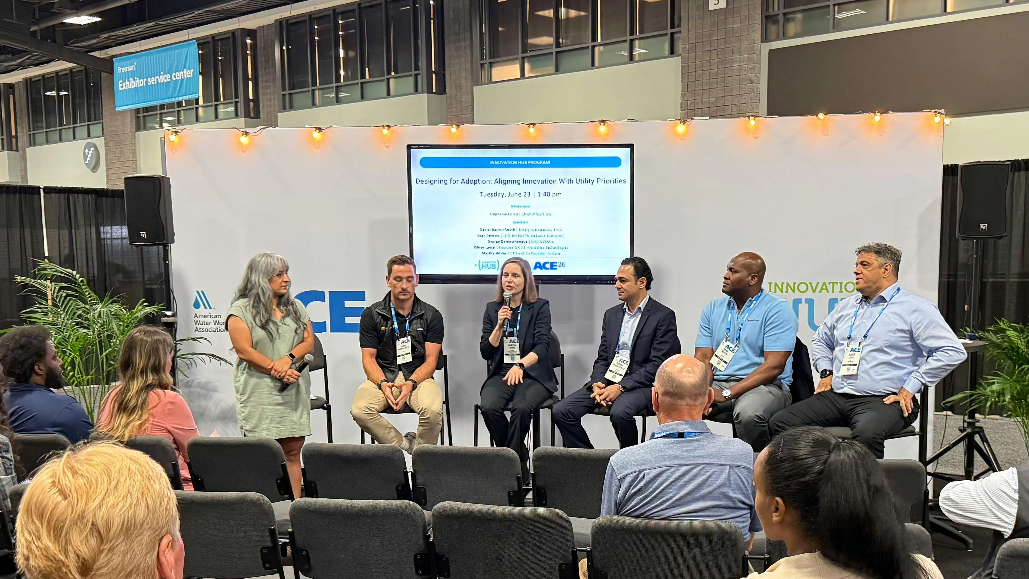 RLCore CTO and Co-founder Martha White (holding microphone) talks to Innovation Pavillion attendees at AWWA ACE26 about RLTune.