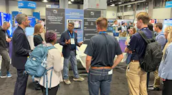 Ganesh Rao, CEO and co-founder of RLCore, talks to several booth visitors about the company and the launch of its product, RLTune, during AWWA ACE26 in Washington, D.C. last month.