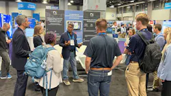Ganesh Rao, CEO and co-founder of RLCore, talks to several booth visitors about the company and the launch of its product, RLTune, during AWWA ACE26 in Washington, D.C. last month.